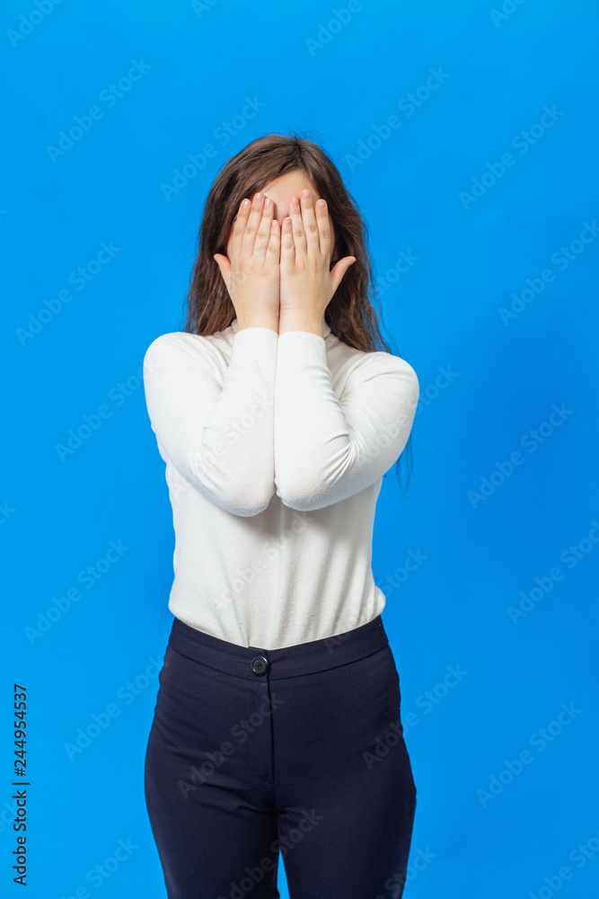 Young beautiful girl isolated on blue background Young beautiful girl isolated on blue background