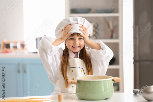 Cute little girl dressed as...