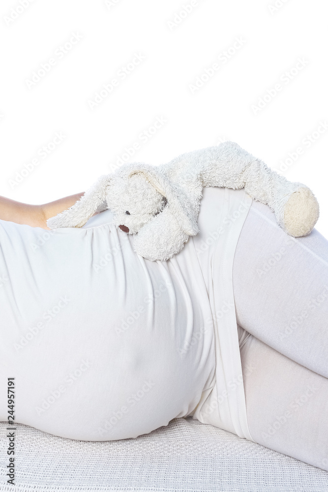 Happy pregnant girl lies on white background Happy pregnant girl lies on white background