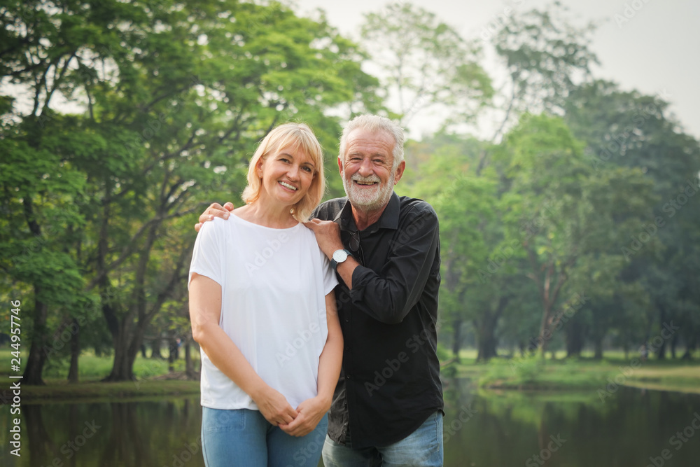 Portrait of Senior couple retirement Man and woman happy in park together Portrait of Senior couple retirement Man and woman happy in park together