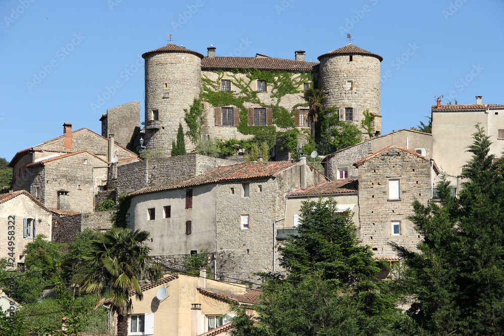 view of an old medieval fortress in the central french mountains
