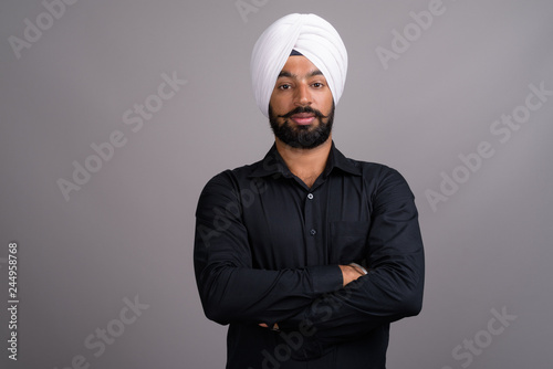 Young Indian Sikh businessman wearing white turban