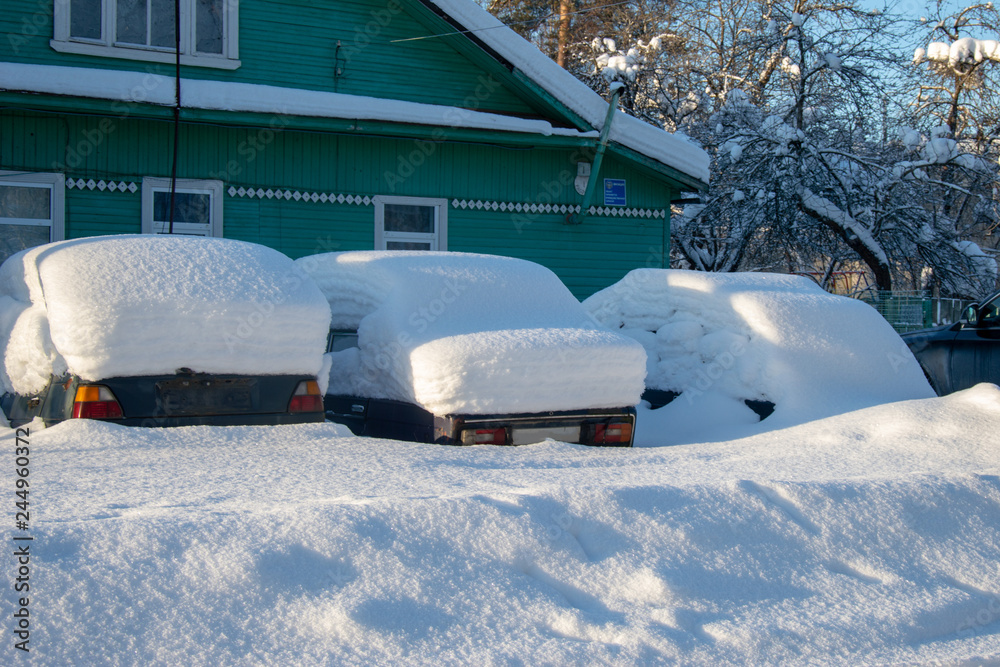the car was covered with a snow blanket the car was covered with a snow blanket
