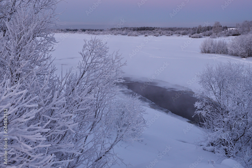 Frosty sunset on the river bank.