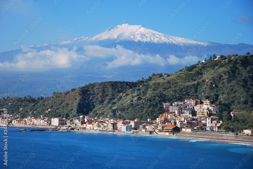 Taormina Bay and Etna Volcano. Italy