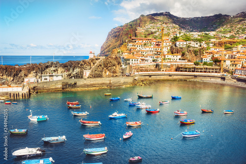 Colorful fishing boats  in Camara de Lobos port. Madeira island, Portugal photo