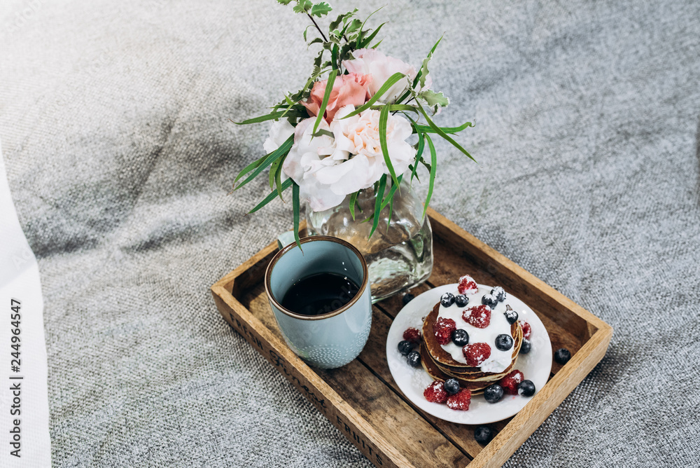 breakfast in bed to the bride. soft focus breakfast in bed to the bride. soft focus