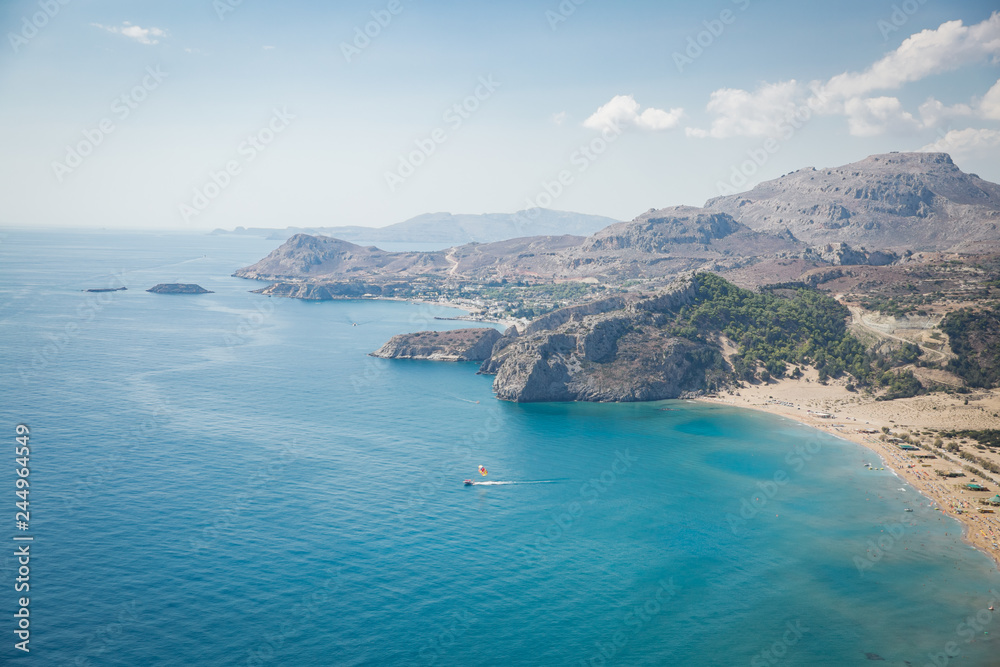 Panoramic top view of Tsampika beach, mountains and blue sea, Rhodes island, Greece. sunny weather.