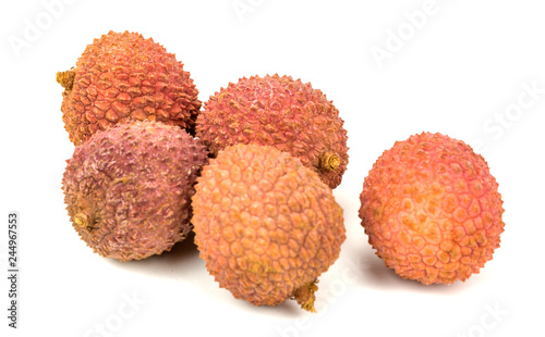  lychee fruit in shell on white
