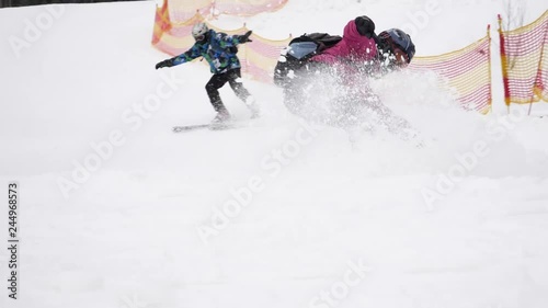 Skiers going down from mountain slope. Winter vacation
