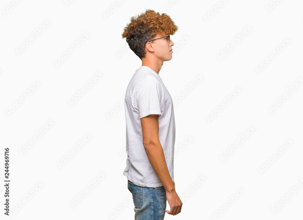 Young handsome man with afro hair wearing sunglasses looking to side, relax profile pose with natural face with confident smile. Young handsome man with afro hair wearing sunglasses looking to side, relax profile pose with natural face with confident smile.