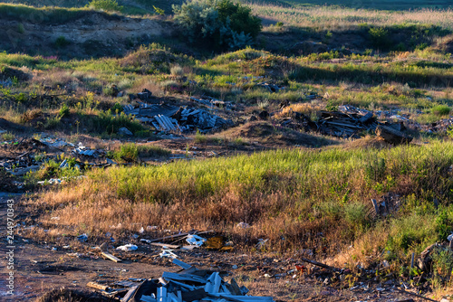 View of garbage scattered over ground in the country