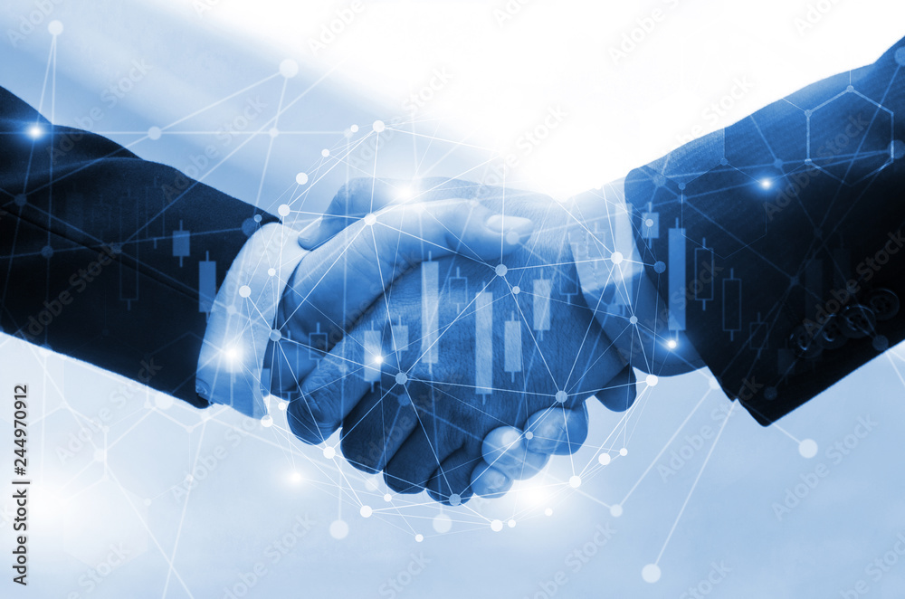 business man or investor handshake on with graph chart of stock market ...