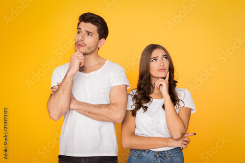 Fotografía Pensive couple thinking and looking away in studio