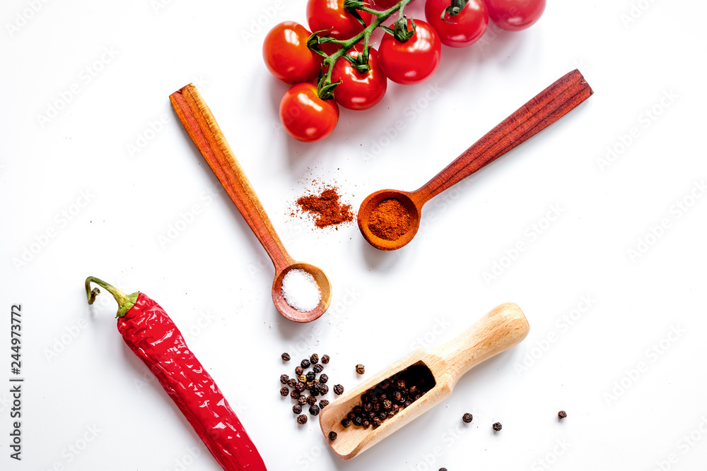 spices in wooden spoon on white background top view spices in wooden spoon on white background top view