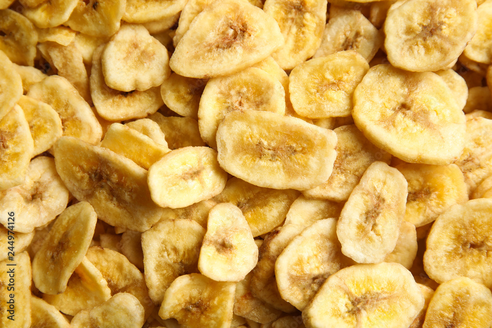 Sweet banana slices as background, top view. Dried fruit as healthy snack Sweet banana slices as background, top view. Dried fruit as healthy snack