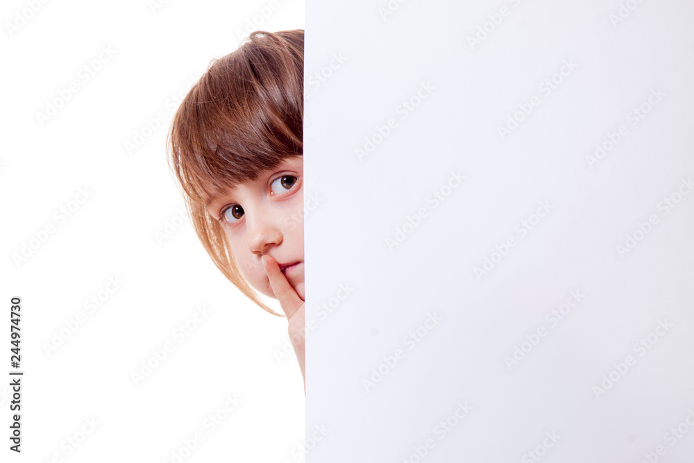 Beautiful child girl showing blank white board for advertising to be inserted Beautiful child girl showing blank white board for advertising to be inserted