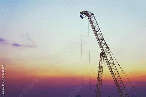 Construction Tower Cranes with Sky Background at Twilight