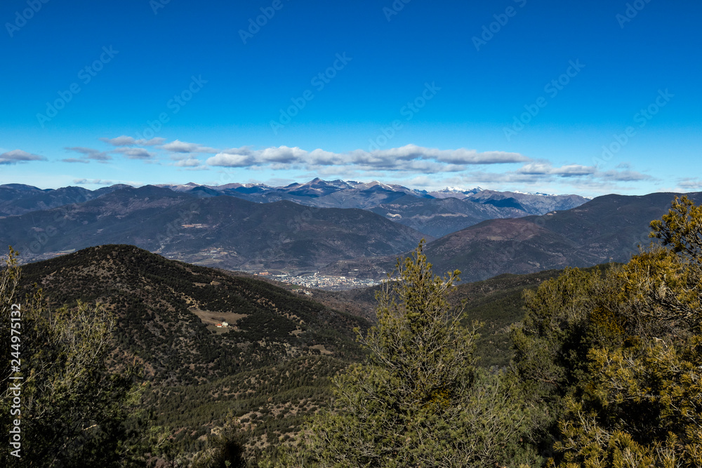 Solid blue sky on a mountain range landscape 