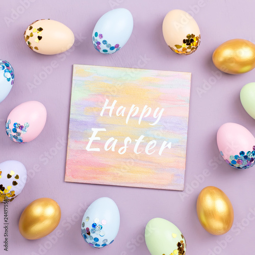 Pastel colorful Easter eggs decorated in sequins on pastel background, copy space. Happy Easter greeting card