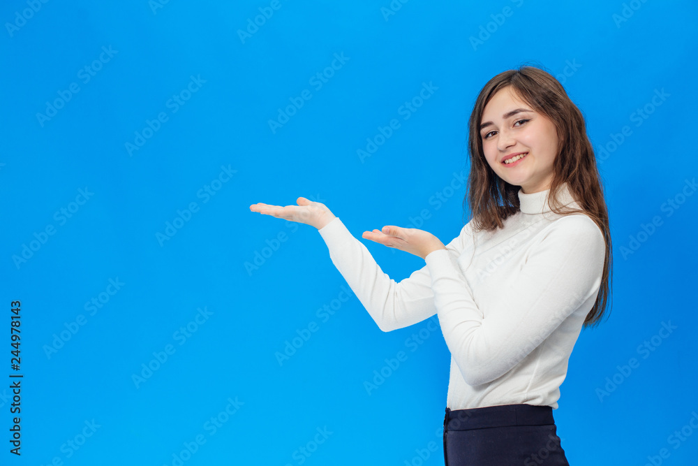 Young beautiful girl isolated on blue background Young beautiful girl isolated on blue background