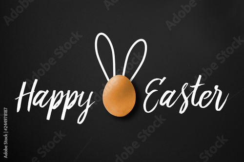 Happy easter greeting card on chalkboard