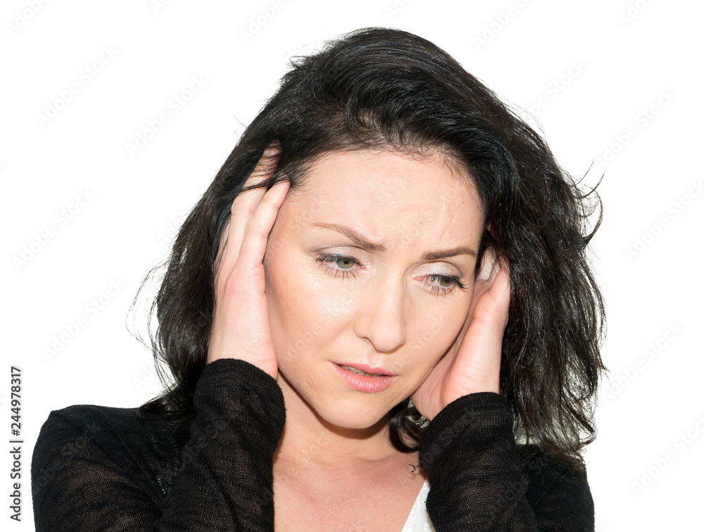 A woman with a headache holding her hand to the head isolated over white background A woman with a headache holding her hand to the head isolated over white background