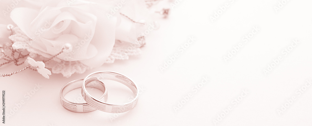 Wedding rings on wedding card on a white background, border design  panoramic banner, toning color living coral Stock Photo | Adobe Stock