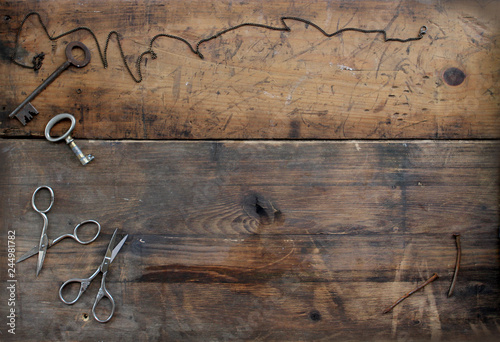 keys and scissors on old wood