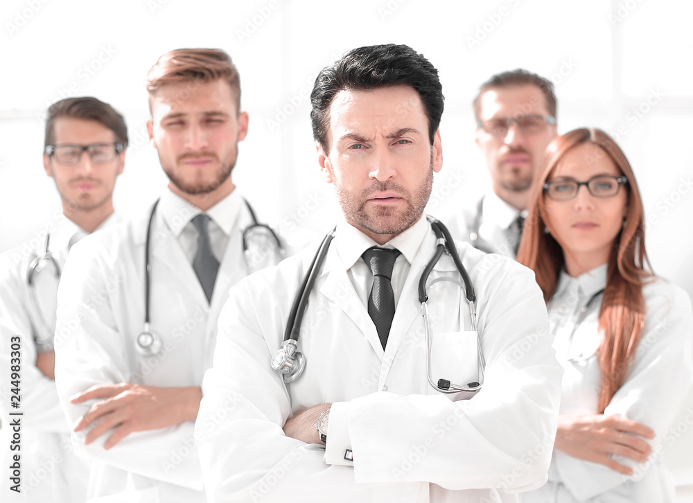 portrait of doctor and medical staff standing in the office portrait of doctor and medical staff standing in the office