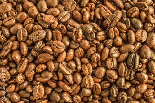 Roasted coffee beans closeup texture background