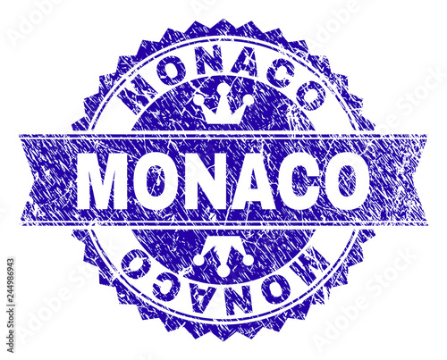 MONACO rosette stamp seal imitation with grunge style. Designed with round rosette, ribbon and small crowns. Blue vector rubber watermark of MONACO text with scratched style.