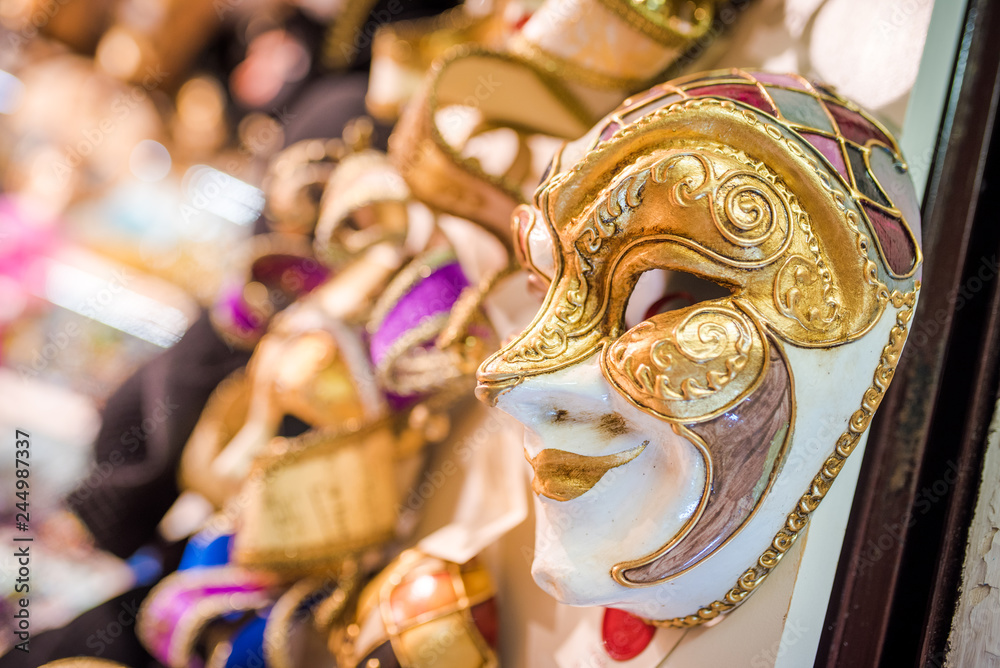 Venetian masks for a masquerade. Touristic souvenir shop.