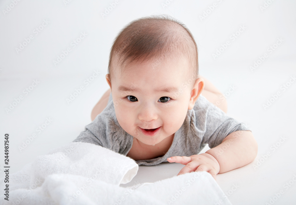 Closeup Asian baby lying on the clean ground Closeup Asian baby lying on the clean ground