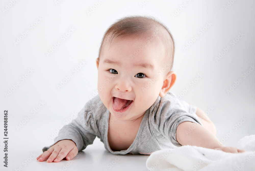 Closeup Asian baby lying on the clean ground Closeup Asian baby lying on the clean ground