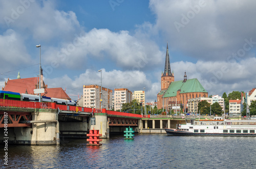 CITYSCAPE - A Bridge, a ship on the river, a church and a boulevard in Szczecin