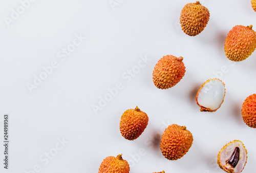 Tropical abstract background. Lychee on the white background.