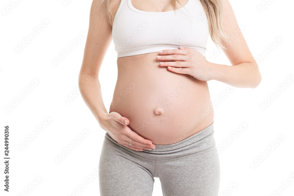 Close-up of pregnant woman touching her belly Close-up of pregnant woman touching her belly