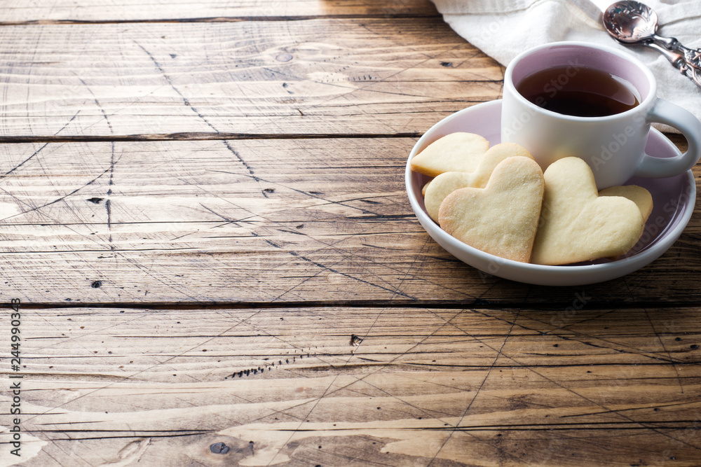 Heart home cookies and cup of coffee on a plate. Concept Valentine's Day Heart home cookies and cup of coffee on a plate. Concept Valentine's Day