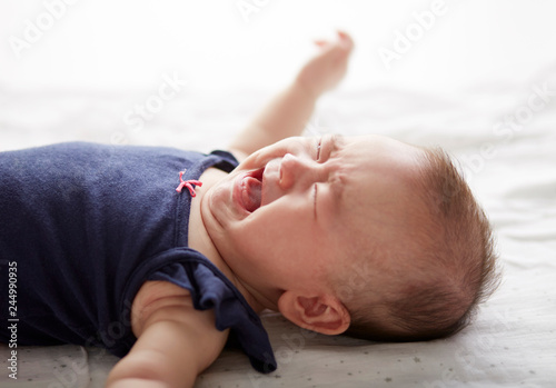 Closeup crying emotional Asian baby