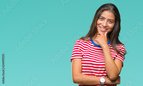 Young beautiful arab woman over isolated background looking confident at the camera with smile with crossed arms and hand raised on chin. Thinking positive.