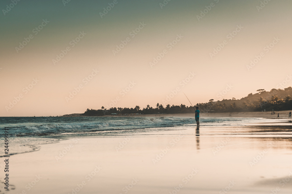 fishing on the beach at night