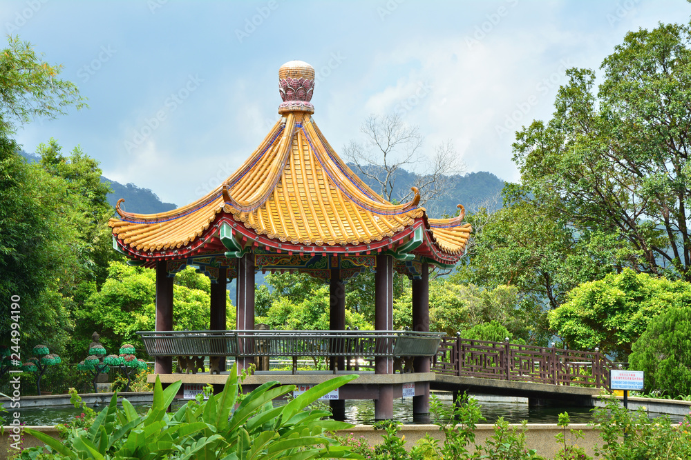 Pavilion over pond in Kek Lok Si temple garden