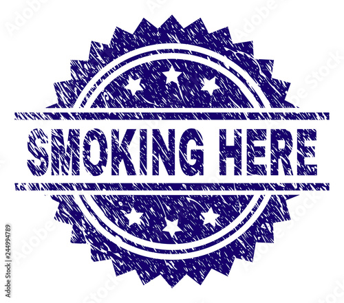 SMOKING HERE stamp seal watermark with distress style. Blue vector rubber print of SMOKING HERE label with corroded texture.