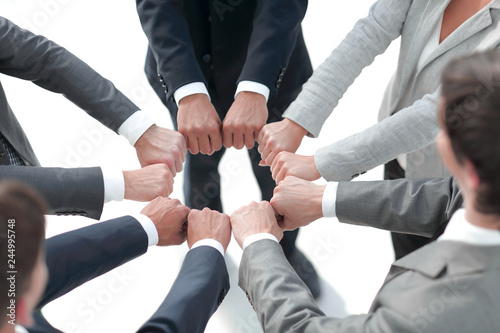 closeup.business people show a circle of hands.