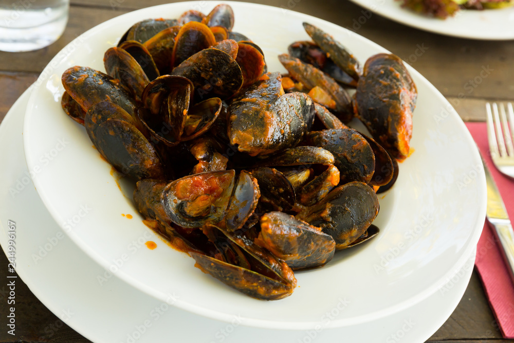 Fototapeta premium Mussels with tomato sauce