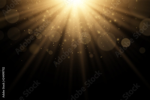 Stylish gold light effect isolated on a black background. Golden rays. Bright explosion. Flying golden magical dust. Sunlight. Abstract lights bokeh. Vector illustration photo