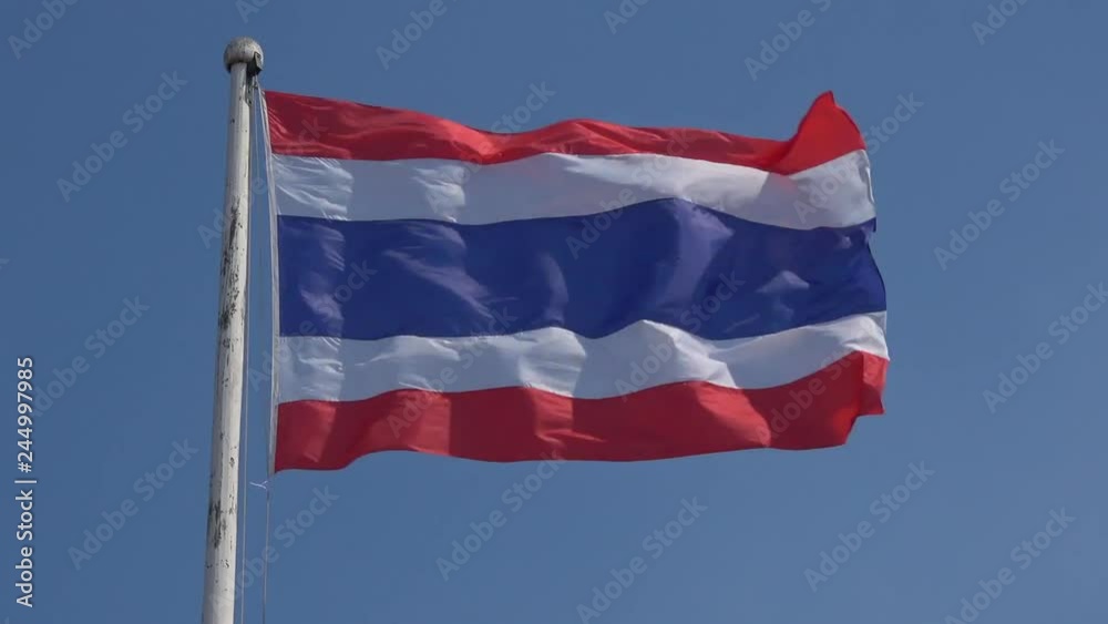 The national flag of Thailand develops against the blue sky The national flag of Thailand develops against the blue sky