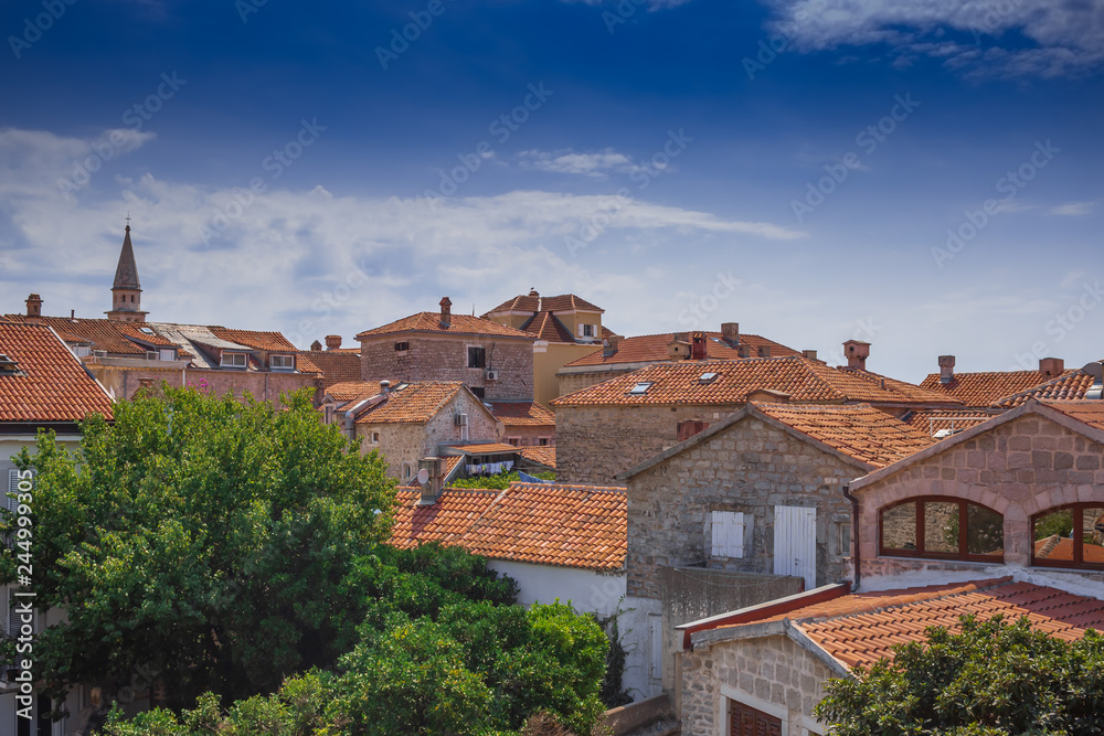 Roofs of old Budva. Summer day in Montenegro. Soft focus and blur.