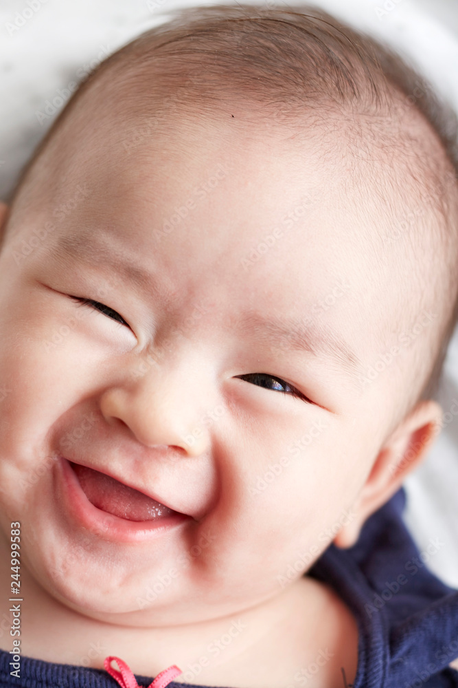 Closeup Asian baby's head expression Closeup Asian baby's head expression
